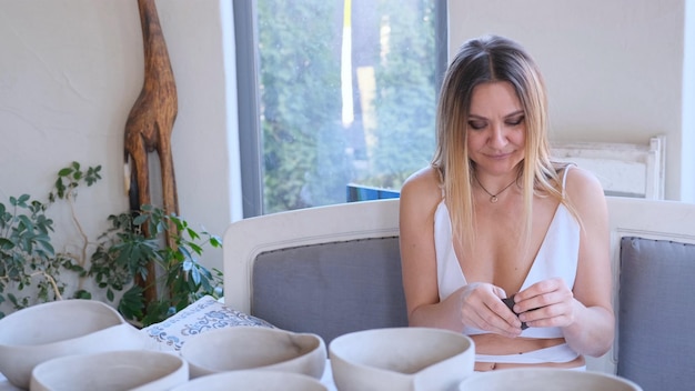 Woman smiling after breast augmentation surgery in a clinic