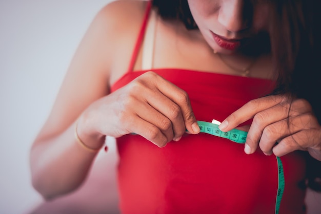 Before and after photo showing results of breast reconstruction and lift surgery following significant weight loss