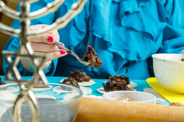 A woman smiling confidently after breast reconstruction surgery, with a background suggesting a recovery setting in Tunisia.