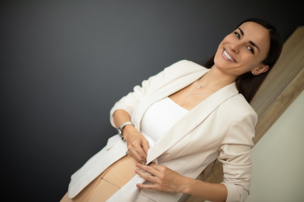 Before and after photo of a woman after a tummy tuck surgery, showing a flatter stomach