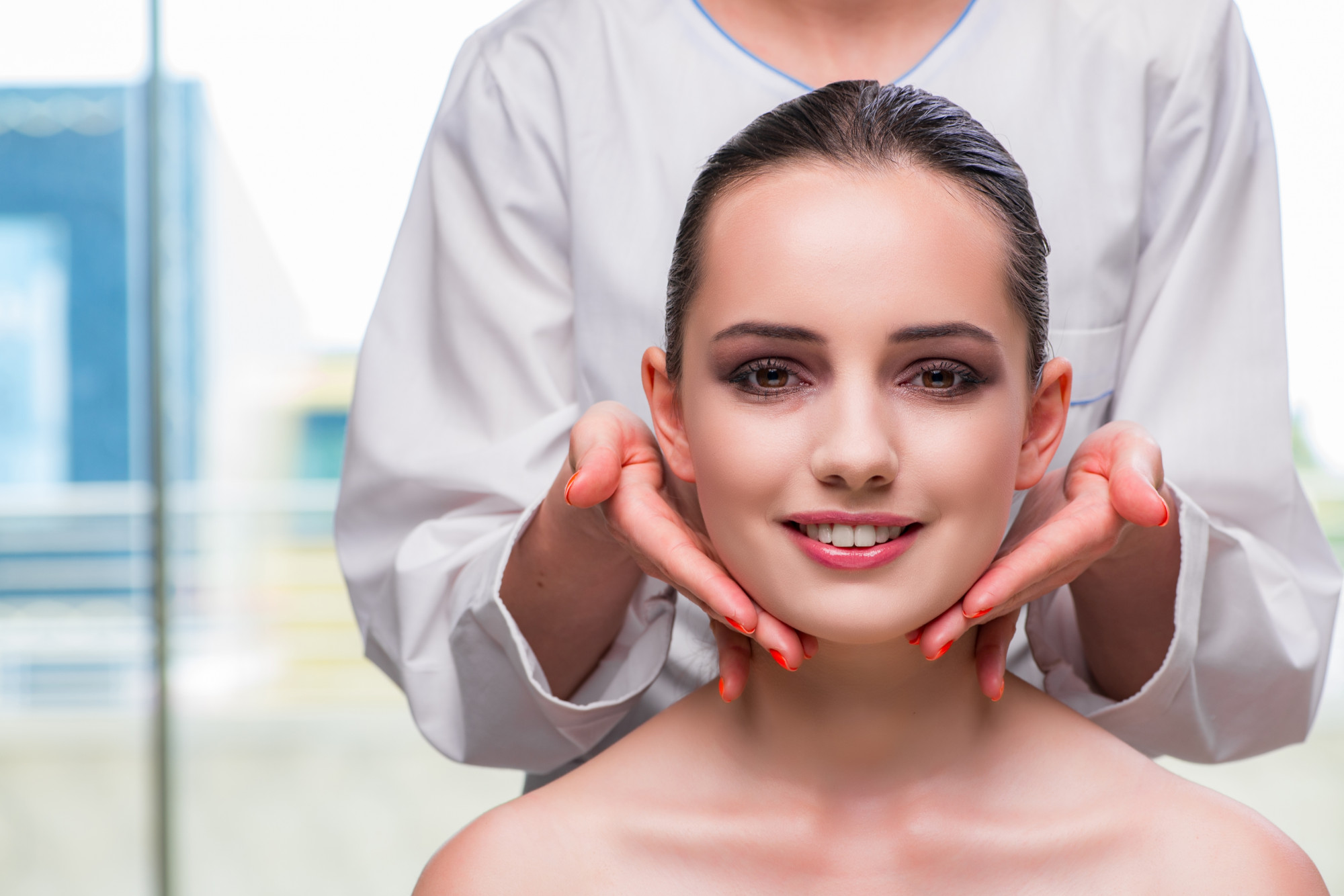 Smiling woman after facelift surgery in Tunisia showing natural results